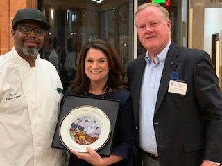Tim Hemphill presents Stacey Messina with special commemorative plate for Chef Leon West